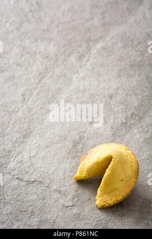 Fortune cookie on gray stone background Stock Photo