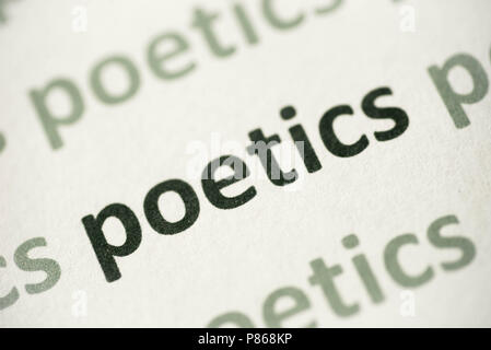 word poetics printed on white paper macro Stock Photo