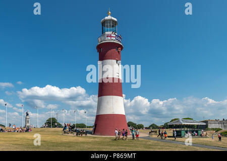 On yet another hot day in July, tourists wander around Smeaton's Tower on Plymouth Hoe seeking whatever shade they can find, as  temperatures in South Stock Photo