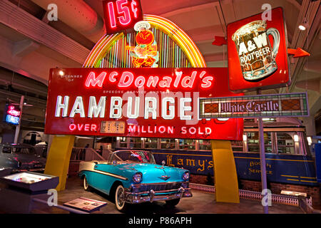 Dearborn, MI / USA - 04.22.2018: old  blue chevrolet bel air car with colorful Mcdonalds neon advertisement Stock Photo