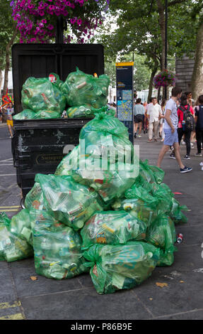 Rubbish bags piled high in Leicester Square, London awaiting collection by Westminster Council Stock Photo