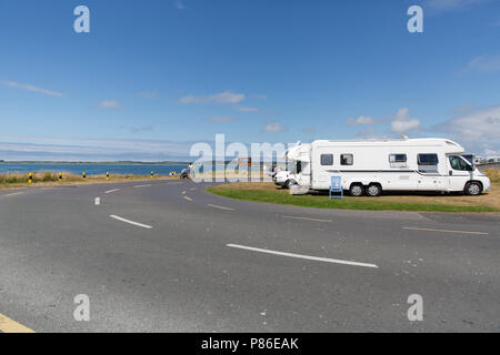 Rosses Point, Sligo, Ireland. 8th July 2018: People enjoying sunny weather making the most out of the record high temperatures heating Ireland having great time on the beach or walking around the beautiful Rosses Point Village in County Sligo Ireland . Stock Photo