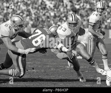 Tony Dorsett, Dallas Cowboys running back, second from left, gets ready to  toss the ball to the sidelines after rushing for over 1,000 yards in his  rookie season, Sunday, Dec. 18, 1977