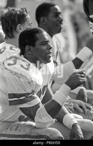 Tony Dorsett, Dallas Cowboys running back, second from left, gets ready to  toss the ball to the sidelines after rushing for over 1,000 yards in his  rookie season, Sunday, Dec. 18, 1977