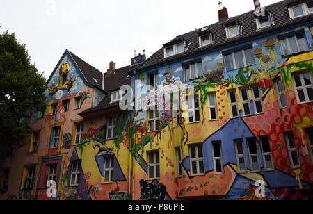 Duesseldorf, Germany. 09th July, 2018. Residential homes covered with 'street art style' paintings are on the Kiefernstrasse in the district of Flingern. The street became known in the 1980s through the squatting of the former factory houses of the former steelwork Kloeckner and was also associated with the RAF (Red Army Faction). Today's residents, who have different nationalities, have regular rental agreements with the city. · NO WIRE SERVICE · Credit: Horst Ossinger/dpa/Alamy Live News Stock Photo