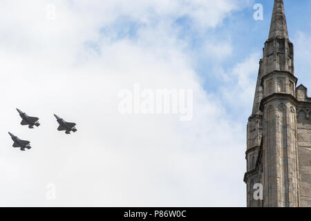 Windsor, UK. 10th July, 2018. Three of Britain’s new F-35 Lightning stealth fighter jets, flying for the first time in a public event, pass over the parish church of St John the Baptist in Windsor as part of a flypast to mark 100 years of the Royal Air Force. The RAF, the world’s first independent air force, was formed on 1st April 1918 when the Royal Flying Corps and the Royal Naval Air Service were merged. Credit: Mark Kerrison/Alamy Live News Stock Photo