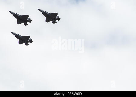 Windsor, UK. 10th July, 2018. Three of Britain’s new F-35 Lightning stealth fighter jets, flying for the first time in a public event, pass over the parish church of St John the Baptist in Windsor as part of a flypast to mark 100 years of the Royal Air Force. The RAF, the world’s first independent air force, was formed on 1st April 1918 when the Royal Flying Corps and the Royal Naval Air Service were merged. Credit: Mark Kerrison/Alamy Live News Stock Photo
