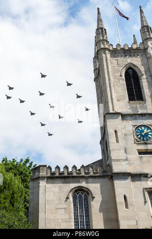 Windsor, UK. 10th July, 2018. Aircraft, including Britain’s new F-35 Lightning stealth fighter jet flying for the first time in a public event, fly over the parish church of St John the Baptist in Windsor as part of a flypast to mark 100 years of the Royal Air Force. The RAF, the world’s first independent air force, was formed on 1st April 1918 when the Royal Flying Corps and the Royal Naval Air Service were merged. Credit: Mark Kerrison/Alamy Live News Stock Photo