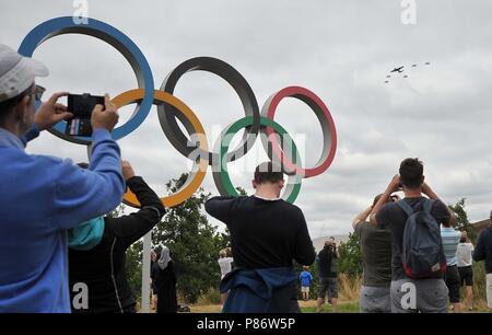 Stratford, London, UK. 10th July, 2018. Lancaster leads the Spitfires and Hurricanes over the Olympic rings. Royal Air Force (RAF) 100 years celebration flypast. Queen Elizabeth Olympic Park. Stratford. London. UK. 10/07/2018. Credit: Sport In Pictures/Alamy Live News Stock Photo