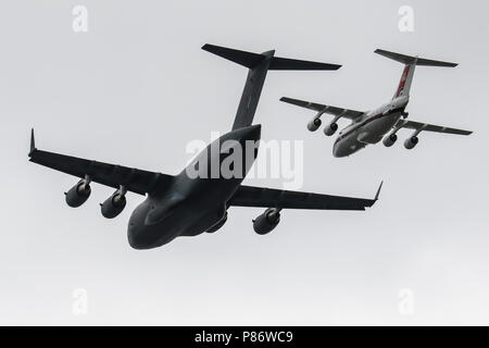 London, UK. 10th July 2018. A Boeing C-17 Globemaster 3 and a BAe 146 fly over Central London during the RAF100 Flypast Credit: James Hancock/Alamy Live News Stock Photo