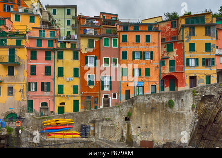 Riomaggiore is a village and comune in the province of La Spezia, situated in a small valley in the Liguria region of Italy. Stock Photo