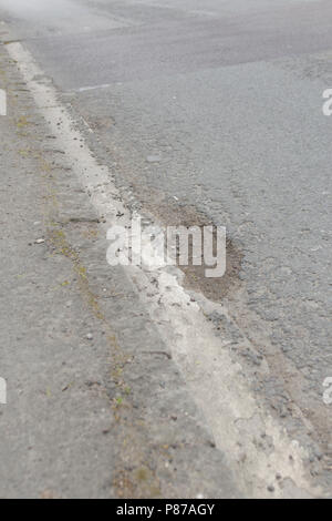 Pot holes in Carterton, Oxfordshire UK. 13th May 2018. UK Weather: Pot holes in West Oxfordshire, multiple potholes on the streets of Oxfordshire. Stock Photo