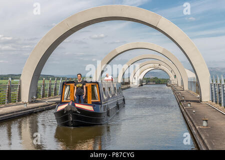 Ship leaves the Falkirk Wheel, rotating boat lift in Scotland, Stock Photo