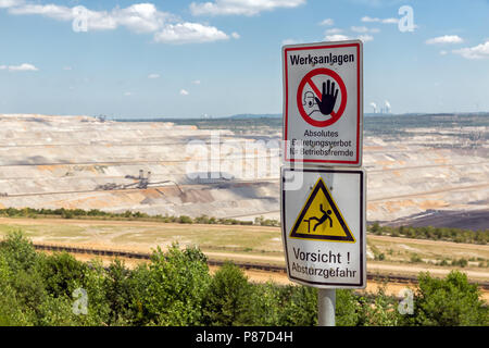 Warning sign near open pit mine Hambach in Germany Stock Photo