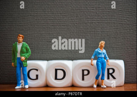 miniature figurines and dice spelling the word GDPR - General Data Protection Regulation Stock Photo