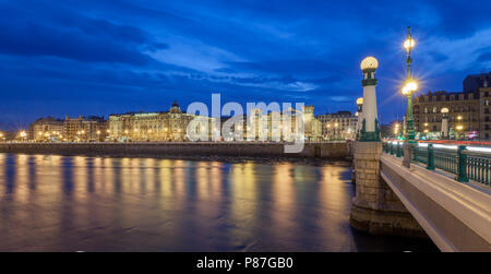 night city view of old town and  kursaal bridge shot from Gros, above urumea river. Stock Photo
