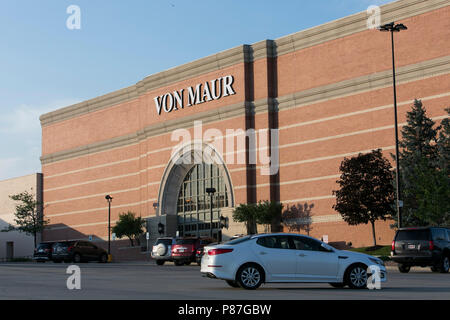 A logo sign outside of a Von Maur, Inc., retail store in Omaha