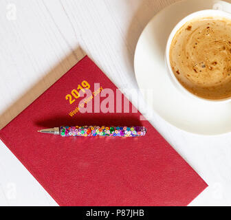 A 2019 desk dairy with a cup of coffee alongside. Stock Photo