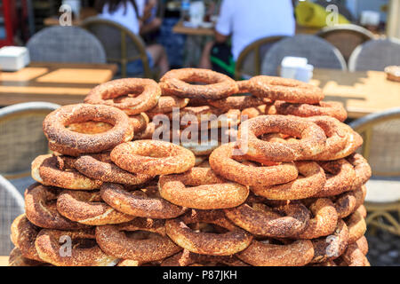 Pile of simits (turkish bagels) on street during daytime. Stock Photo