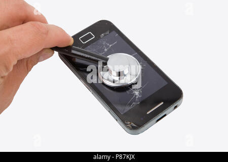 Broken phone display and sttoscope. Repairing damaged phone. Stock Photo