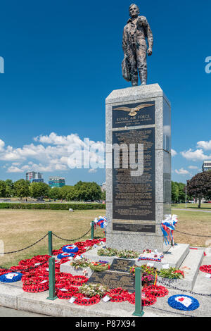 The memorial, dedicated to the Royal Air Force and Commonwealth  & Allied Air Forces, adorned with wreaths on Plymouth Hoe in South Devon. Stock Photo