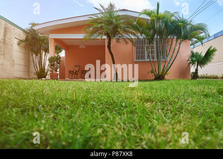 Orange old house latin american style on sunny day Stock Photo