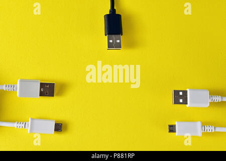 usb cables to transmit data on yellow background Stock Photo