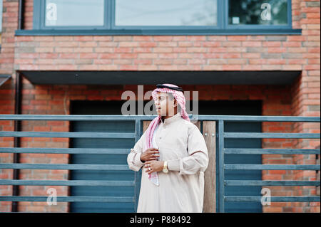 Middle Eastern arab man posed on street against modern building. Stock Photo