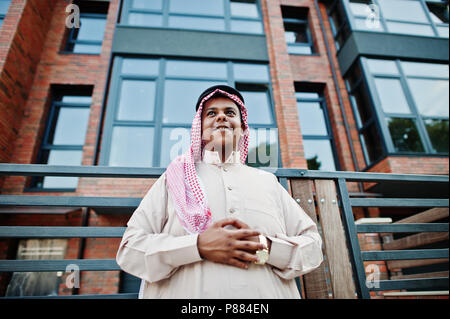 Middle Eastern arab man posed on street against modern building. Stock Photo