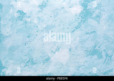 Light blue abstract background or decorative texture of old stucco wall. Textured damaged plaster. Art decor. Stock Photo