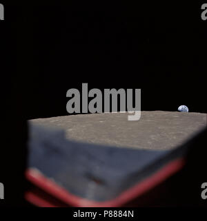 High-oblique view of the moon's surface showing Earth rising above the lunar horizon, looking west-southwest, as photographed from the Apollo 8 spacecraft Stock Photo