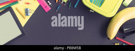 Banner Concept back to school apple backpack stationery on black background. Top view Flat lay Stock Photo