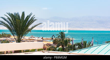 vista of the dead sea evaporation pools and moav mountains of jordan from the roof of a hotel in Ein Bokek in Israel Stock Photo