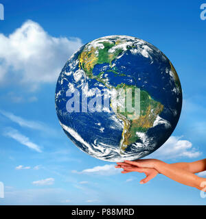 conceptual image of a big globe on hands Stock Photo