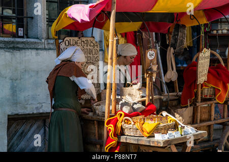 Young womans selling candy in a street of Tallin, Estonia Stock Photo