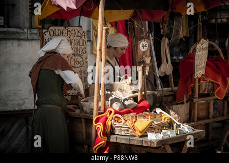 Young womans selling candy in a street of Tallin, Estonia Stock Photo