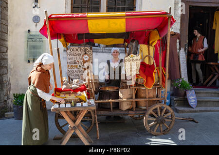 Young womans selling candy in a street of Tallin, Estonia Stock Photo