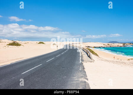 Fuerteventura road through the dunes of Corralejo in the Canary Islands, Spain. Stock Photo