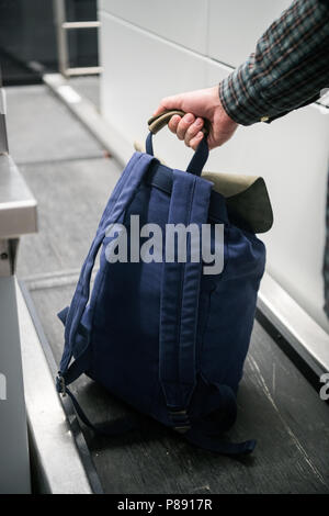 Passenger Weighing Luggage At Airport Check In Stock Photo