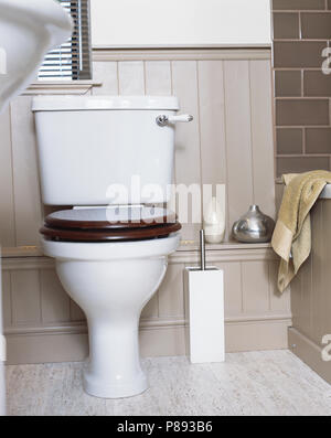 Close-up of toilet with mahogany seat in modern bathroom Stock Photo