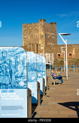 UK, Northern Ireland, Co Antrim, Carrickfergus, Norman Castle and historical information boards Stock Photo