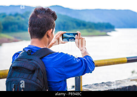 Tourist taking mobile shot in shillong, Umiam Lake Stock Photo