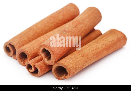 Bunch of some fresh aromatic cinnamon over white background Stock Photo