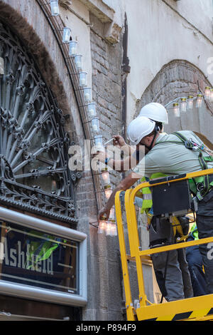 Installing candles in their holders for this evenings Holy Cross ...