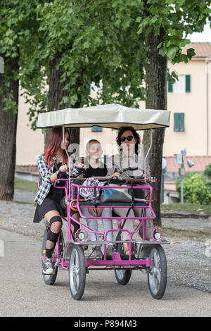 Tourists in pedal car touring on top of the ancient city walls of Lucca, Lucca, Tuscany, Italy, Europe, Stock Photo