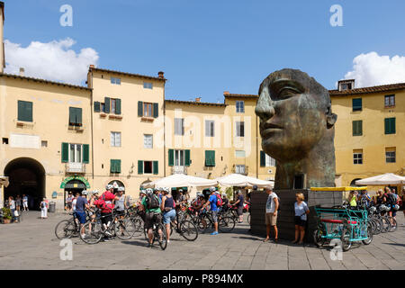Cyclists meeting in the Piazza Anfiteatro Romano, Lucca, Tuscany, Italy, Europe, Stock Photo