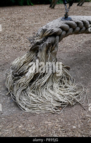 Frayed end of a playground rope swing Stock Photo