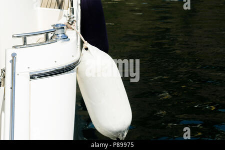 buoy hanging outside the hull of the boat, boat equipment, safety at sea Stock Photo