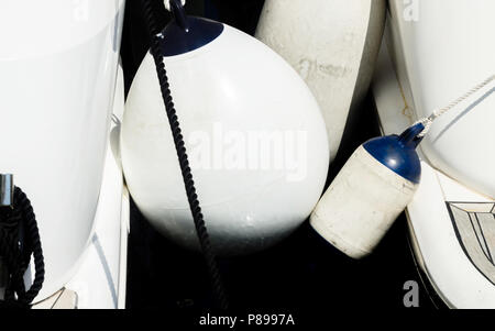 buoy hanging outside the hull of the boat, boat equipment, safety at sea Stock Photo