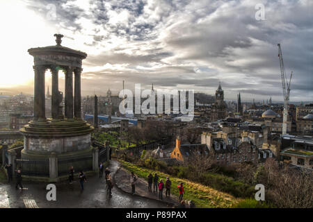 Cloudy skies on New Year's Eve 2017 (31 January 2017) atop Calton Hill with the Edinburgh skyline, Scotland, United Kingdom. HDR Image. Stock Photo